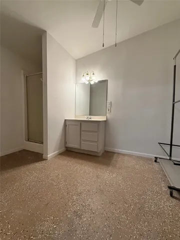 a view of an empty room with a cabinet