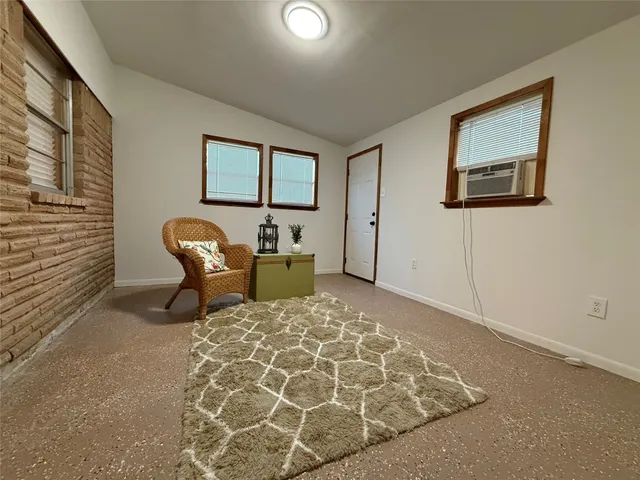 a bedroom with a bed and chair