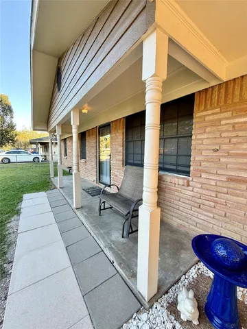 a view of a porch with seating space