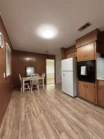 a kitchen with a table and chairs