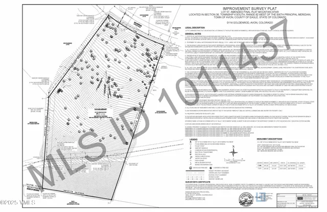a view of a lush green hillside and a building