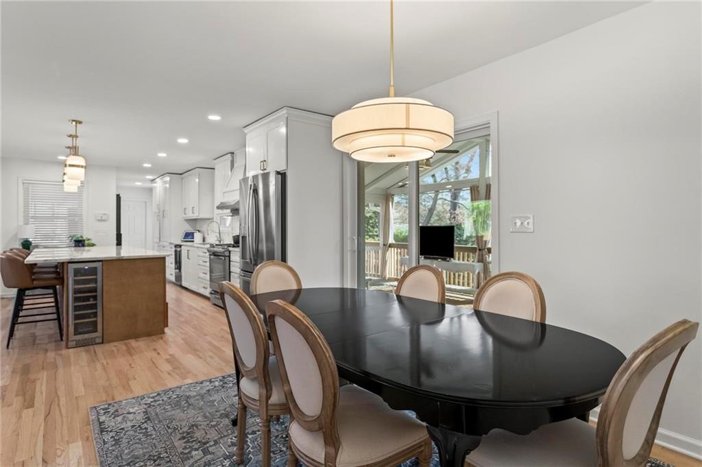 4061 North Cooper Lake Road Southeast Smyrna, GA 30082 - Photo 16 of 45 a view of a dining room with furniture and wooden floor