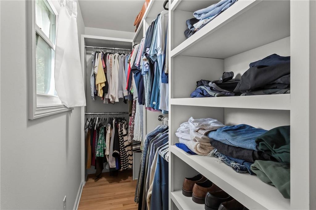 4061 North Cooper Lake Road Southeast Smyrna, GA 30082 - Photo 19 of 45 a view of walk in closet with clothes and shoes
