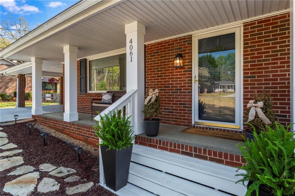 4061 North Cooper Lake Road Southeast Smyrna, GA 30082 - Photo 2 of 45 a view of a house with a potted plant
