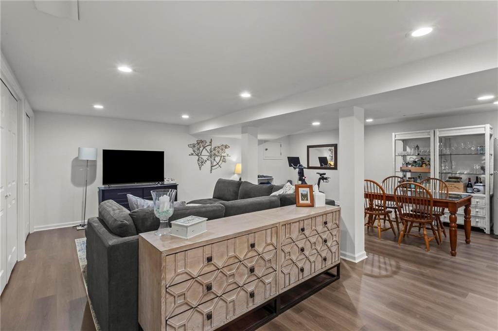 4061 North Cooper Lake Road Southeast Smyrna, GA 30082 - Photo 25 of 45 a living room with furniture and a flat screen tv