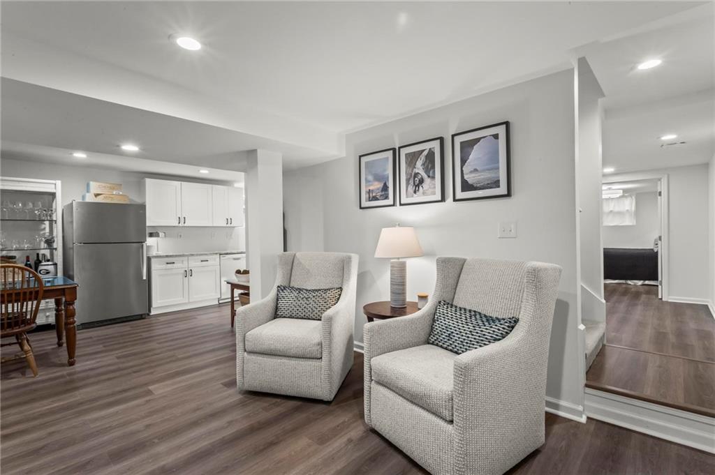 4061 North Cooper Lake Road Southeast Smyrna, GA 30082 - Photo 30 of 45 a living room with furniture and a wooden floor