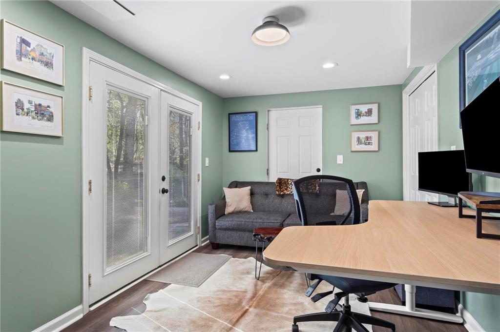 4061 North Cooper Lake Road Southeast Smyrna, GA 30082 - Photo 32 of 45 a room with a couch and a flat screen tv