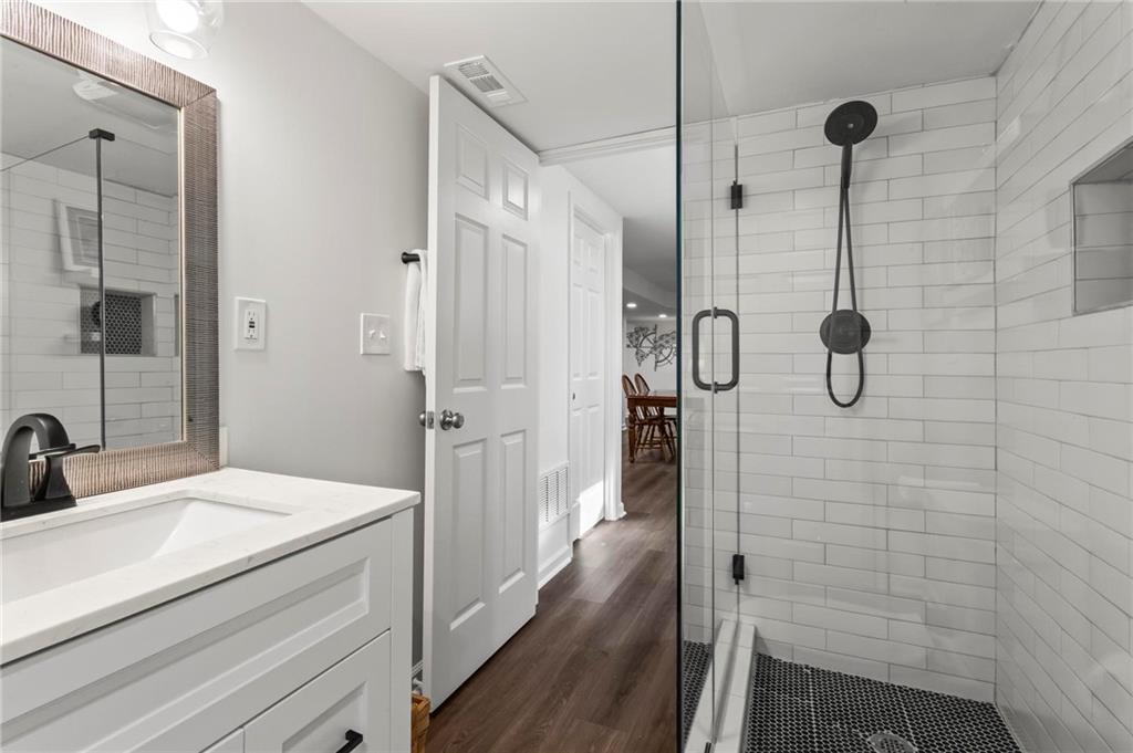 4061 North Cooper Lake Road Southeast Smyrna, GA 30082 - Photo 33 of 45 a bathroom with a shower and a sink