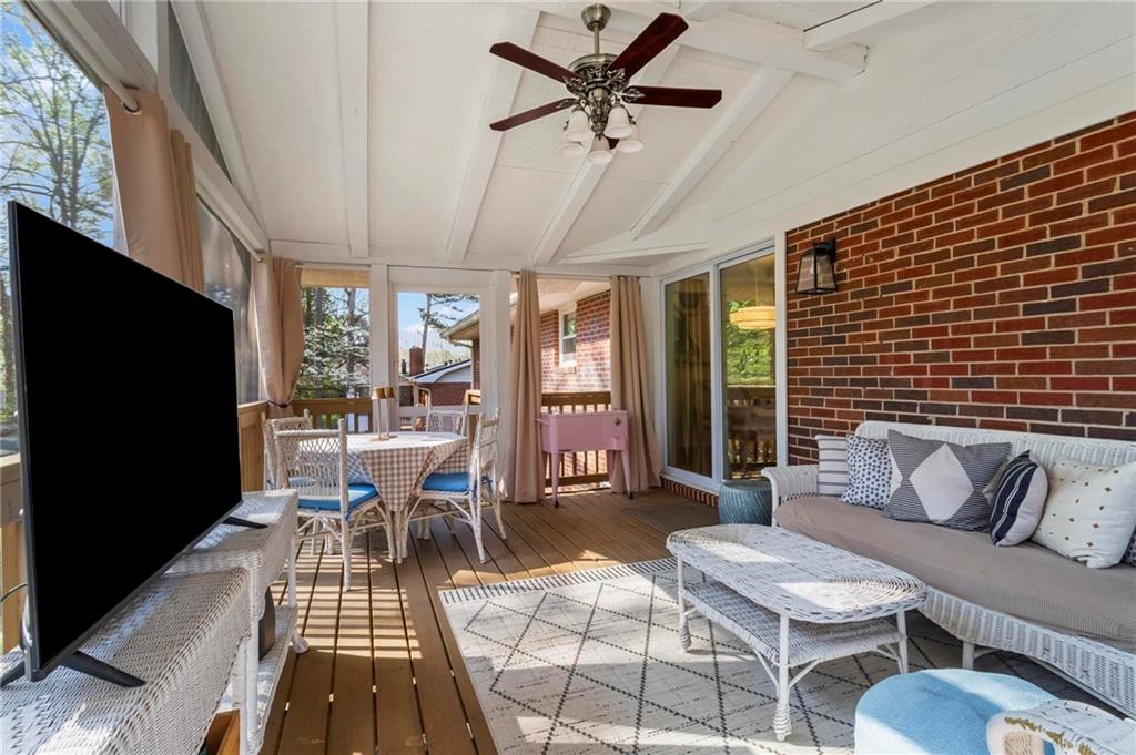 4061 North Cooper Lake Road Southeast Smyrna, GA 30082 - Photo 36 of 45 a living room with furniture and a flat screen tv