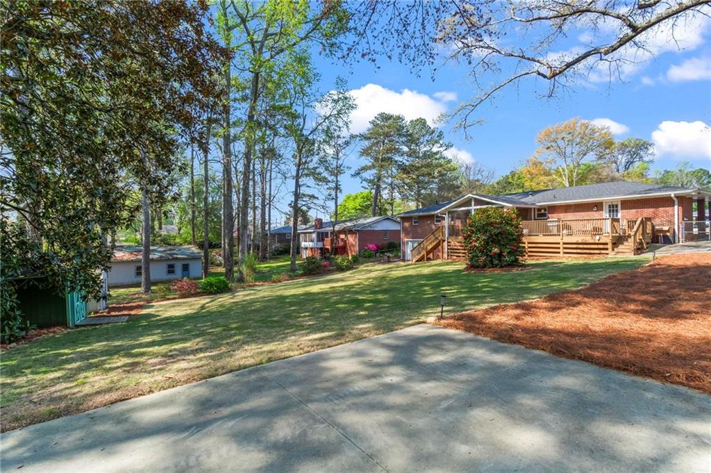 4061 North Cooper Lake Road Southeast Smyrna, GA 30082 - Photo 39 of 45 a view of a house with a yard and tree s