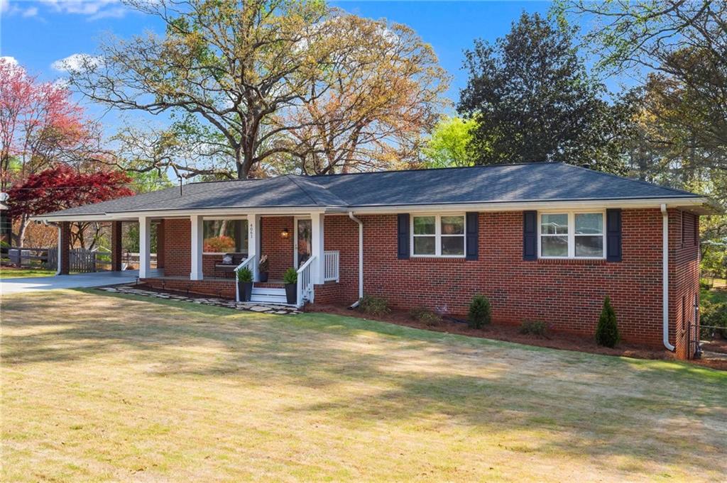 4061 North Cooper Lake Road Southeast Smyrna, GA 30082 - Photo 42 of 45 a view of a house with a yard and sitting area