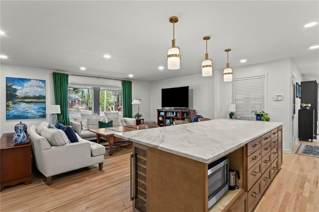 4061 North Cooper Lake Road Southeast Smyrna, GA 30082 - Photo 9 of 45 a large kitchen with kitchen island a large island in it