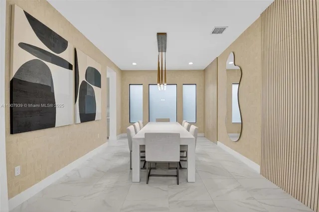 a kitchen with cabinets and stainless steel appliances