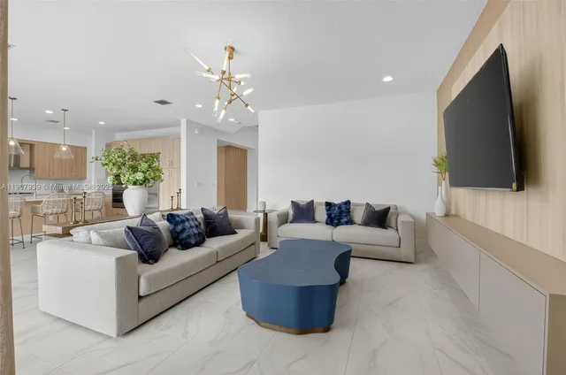 a spacious bathroom with a double vanity sink a mirror and a bathtub
