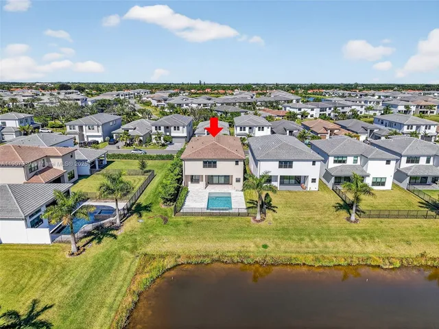 an aerial view of a house with a swimming pool