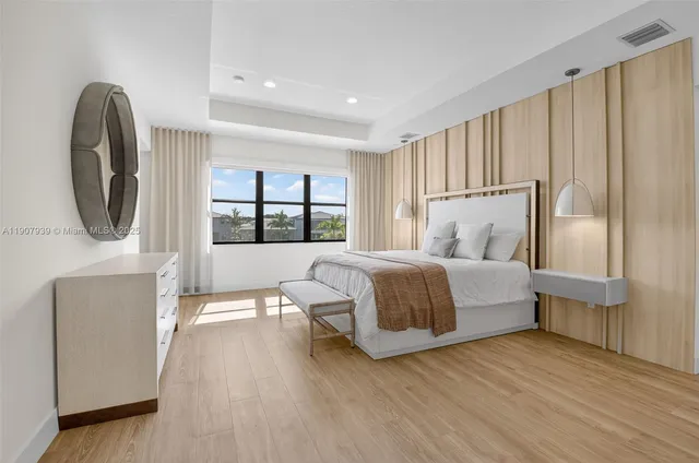 a bedroom with a bed and a chair