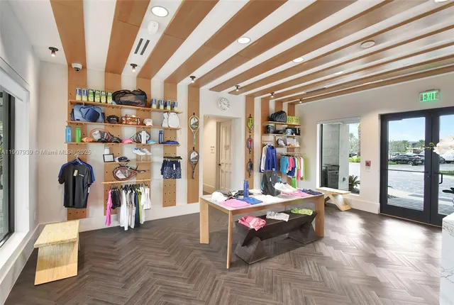 a view of a livingroom with furniture window and wooden floor