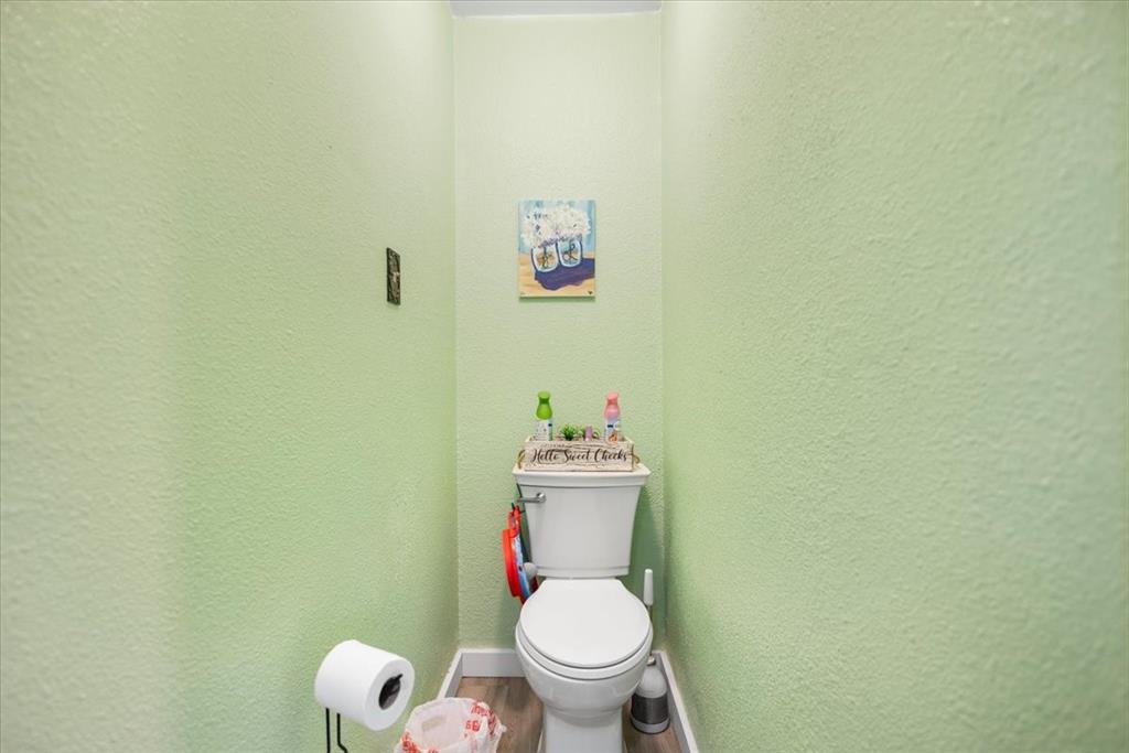 130 Beasley Road Combine, TX 75159 - Photo 17 of 19 a white toilet sitting next to a white wall and a sink