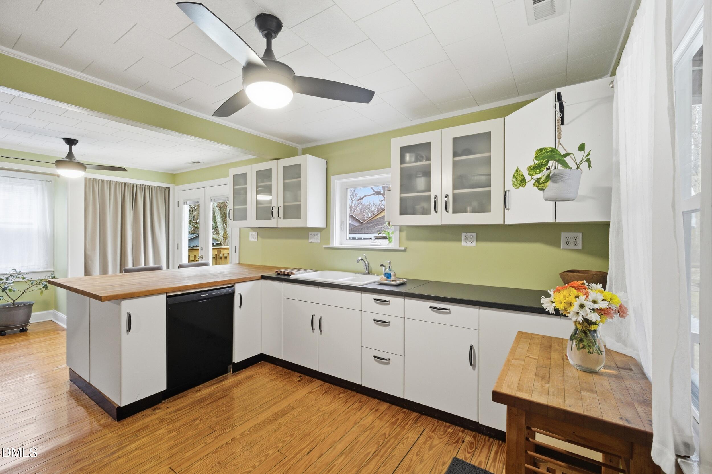 700 Sasser Street Raleigh, NC 27604 - Photo 13 of 25 a kitchen with a sink cabinets and window