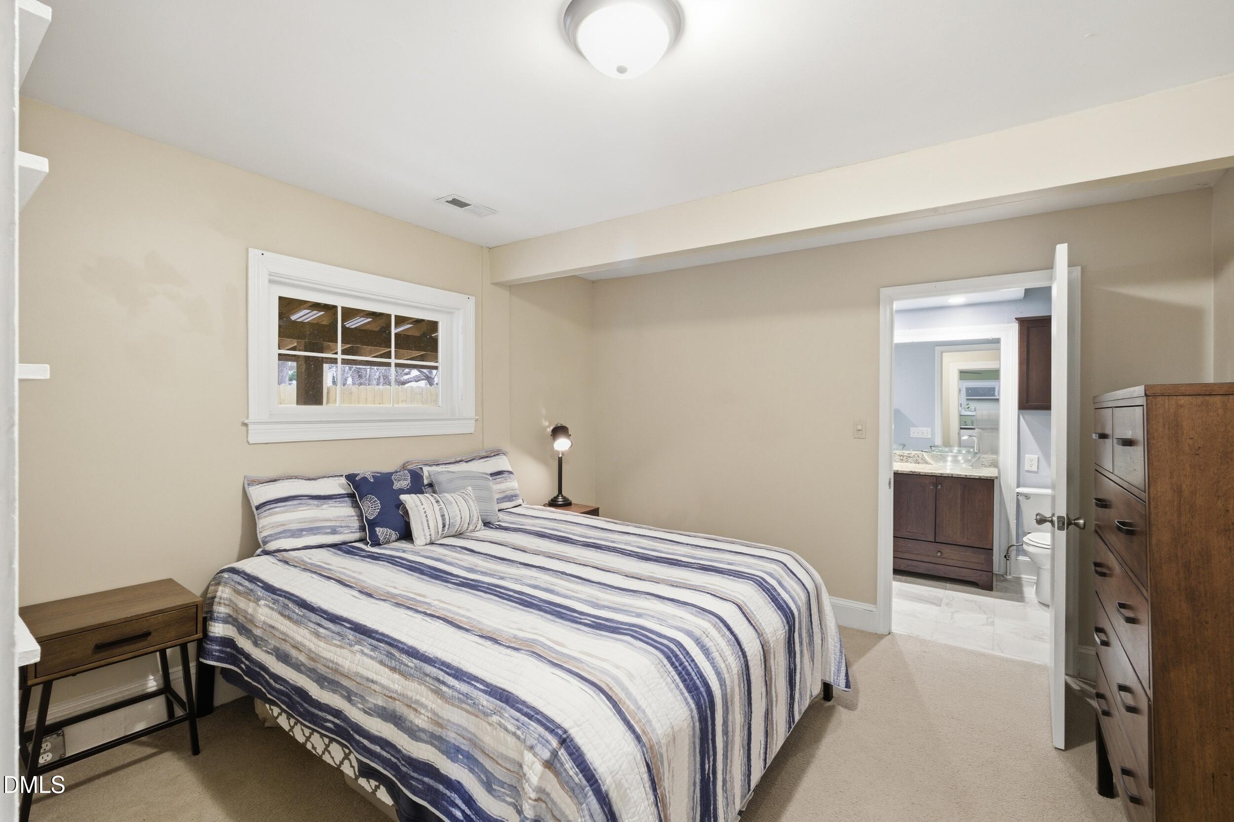 700 Sasser Street Raleigh, NC 27604 - Photo 15 of 25 a bedroom with a bed and a closet