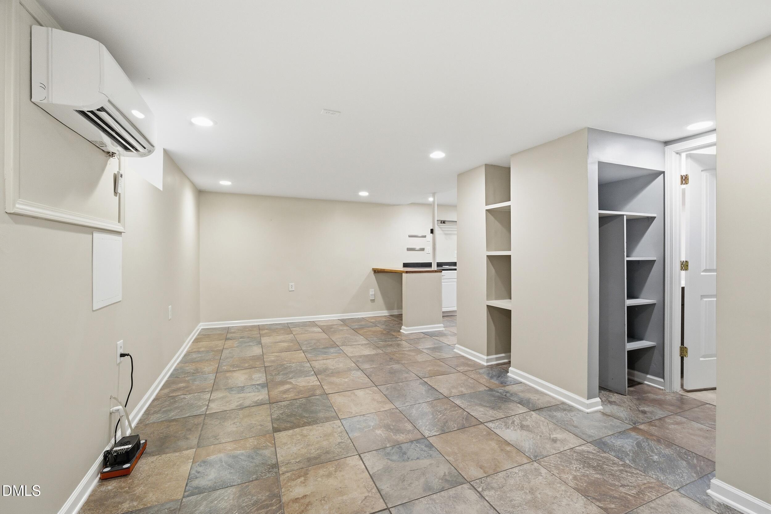 700 Sasser Street Raleigh, NC 27604 - Photo 17 of 25 a view of empty room with kitchen and windows