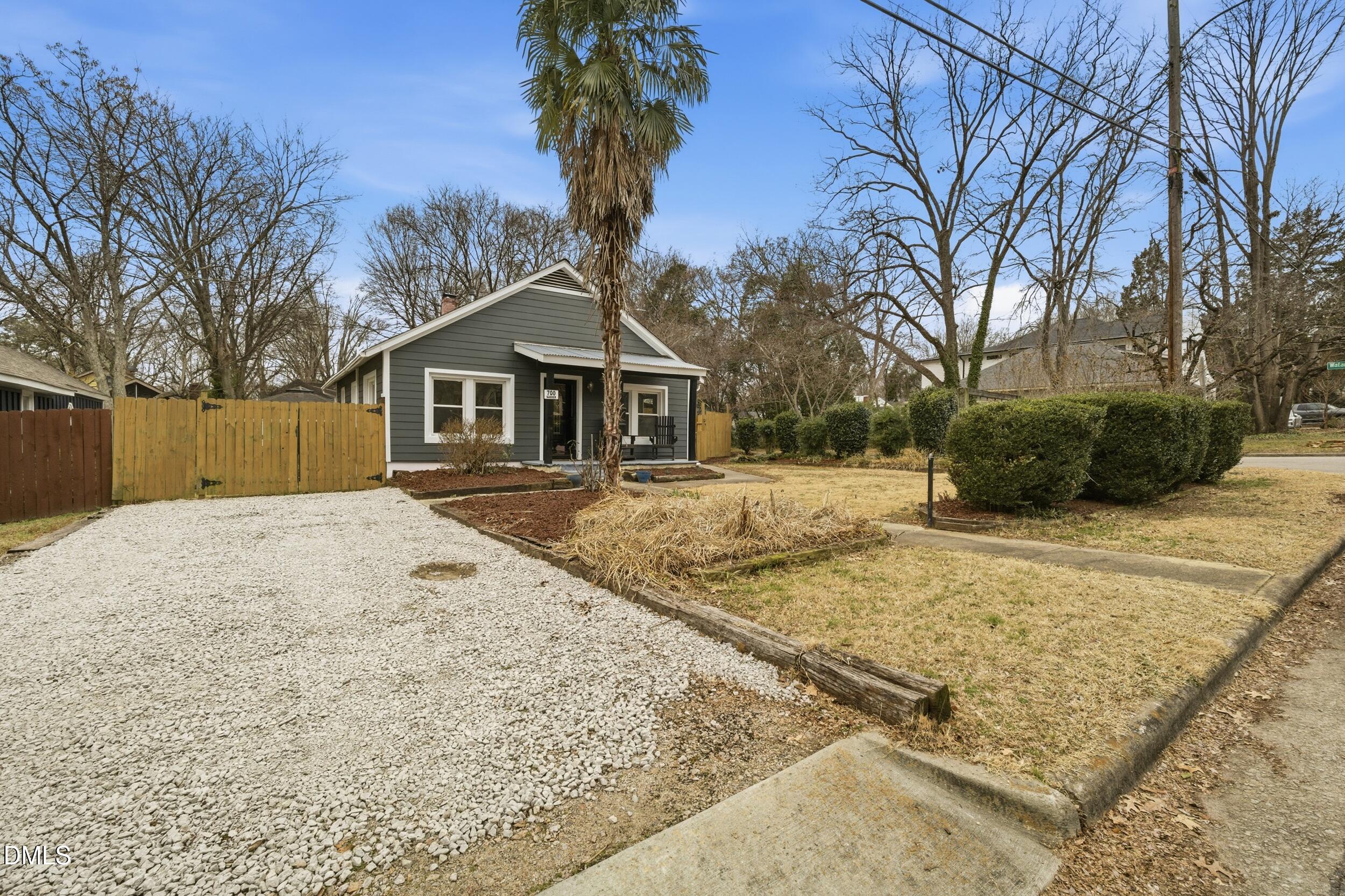 700 Sasser Street Raleigh, NC 27604 - Photo 3 of 25 a front view of a house with a yard covered in snow