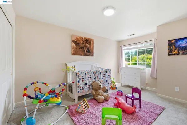a room with toys and a book shelf
