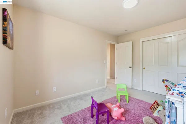 a view of closet with wooden floor