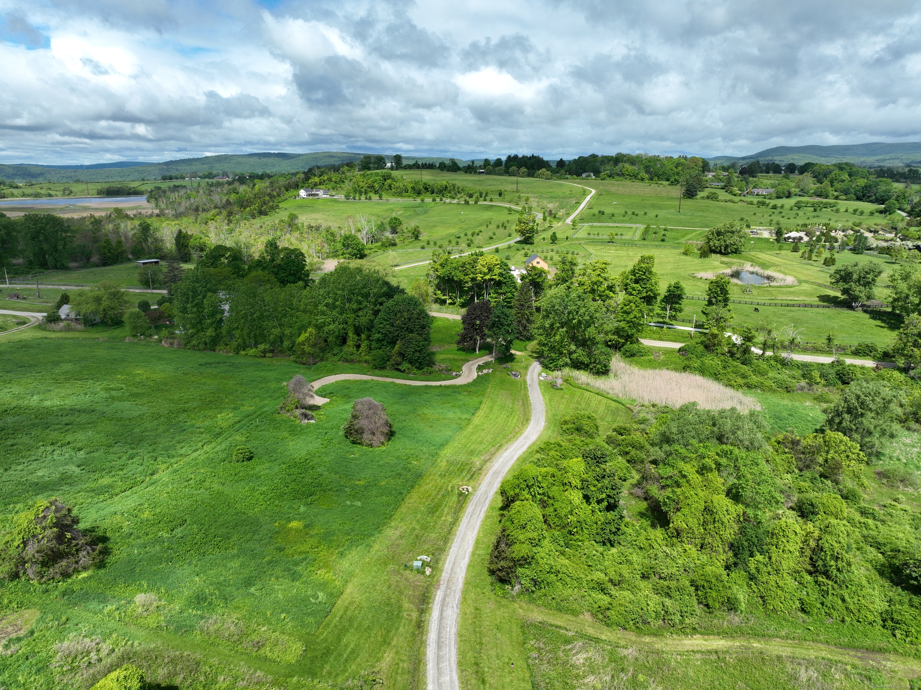 14 Red Mountain Road Lakeville, CT 06039 - Photo 4 of 21 a view of a lush green field