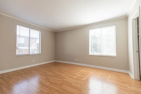 a kitchen with a sink cabinets stainless steel appliances and a window