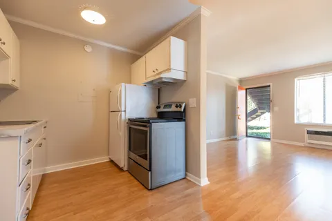 a view of a house with a yard and plants