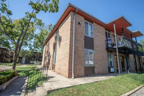 a view of a house with a street