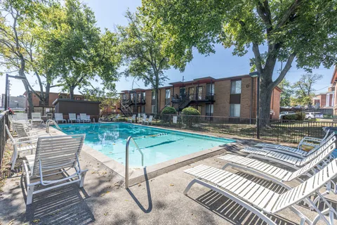 a view of a patio with table and chairs and potted plants