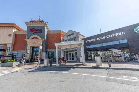 a view of building with cars