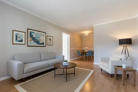 a living room with furniture and a table