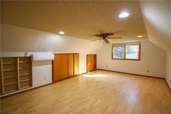 an empty room with a empty space and windows