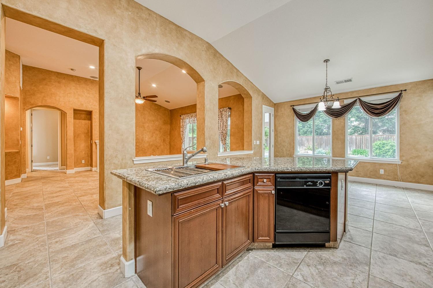 2267 Graybark Avenue Clovis, CA 93619 - Photo 18 of 42 a kitchen with a stove and a sink