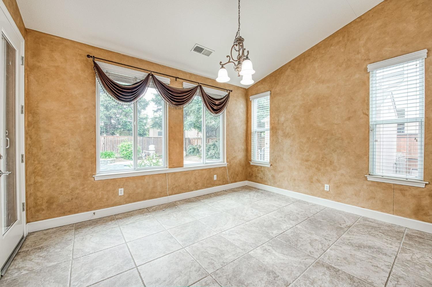 2267 Graybark Avenue Clovis, CA 93619 - Photo 19 of 42 a view of an empty room with a window
