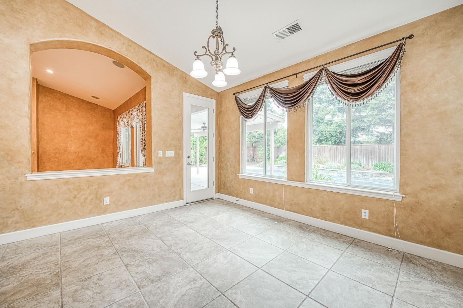 2267 Graybark Avenue Clovis, CA 93619 - Photo 20 of 42 a view of an empty room with a window