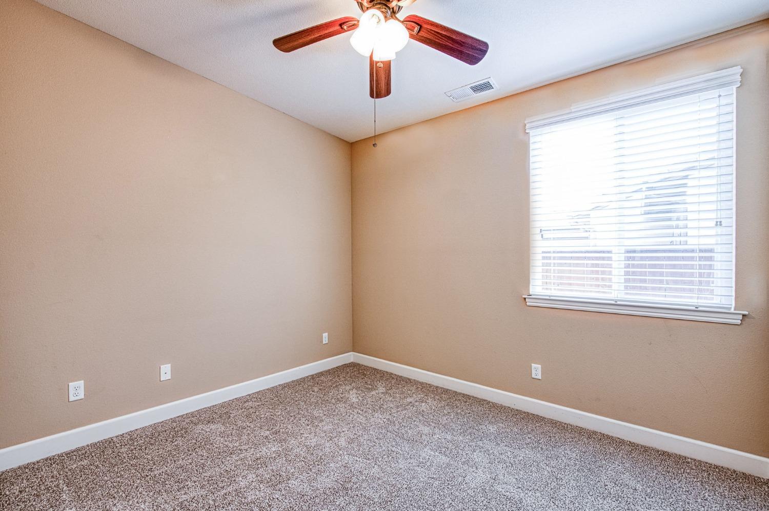 2267 Graybark Avenue Clovis, CA 93619 - Photo 27 of 42 a view of an empty room with a window