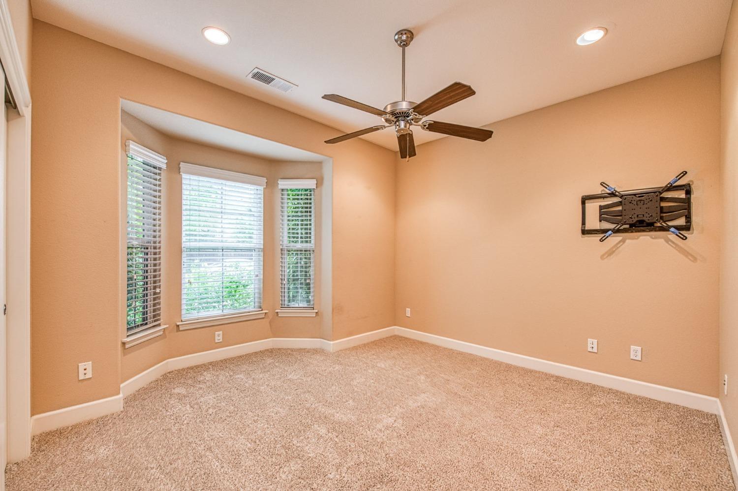 2267 Graybark Avenue Clovis, CA 93619 - Photo 30 of 42 a view of a livingroom with a ceiling fan and window