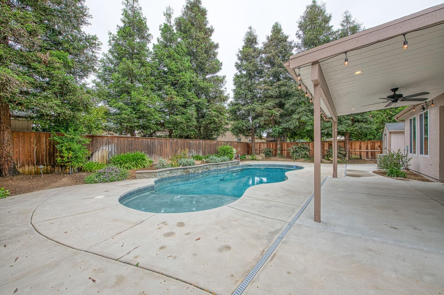 2267 Graybark Avenue Clovis, CA 93619 - Photo 37 of 42 a view of a house with entertaining space and a road