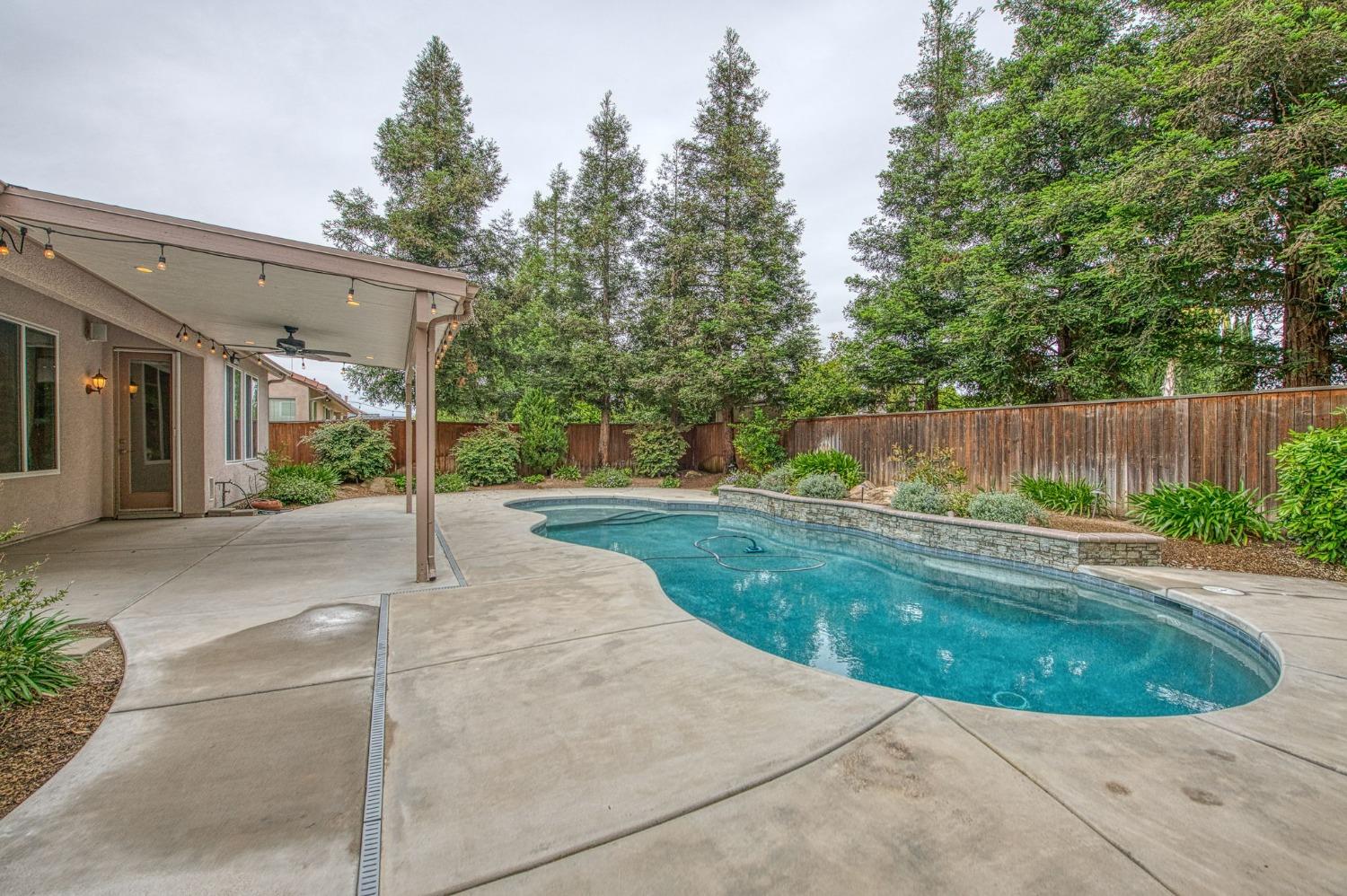 2267 Graybark Avenue Clovis, CA 93619 - Photo 41 of 42 a view of a house with backyard and tree