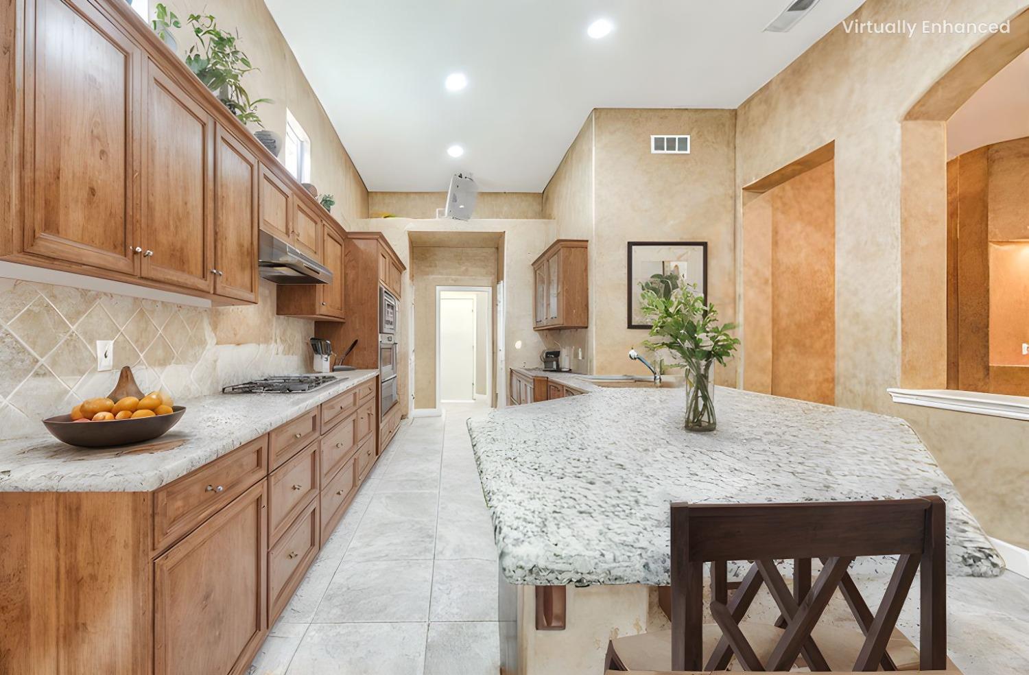 2267 Graybark Avenue Clovis, CA 93619 - Photo 9 of 42 a kitchen with stainless steel appliances granite countertop a stove a sink and a refrigerator