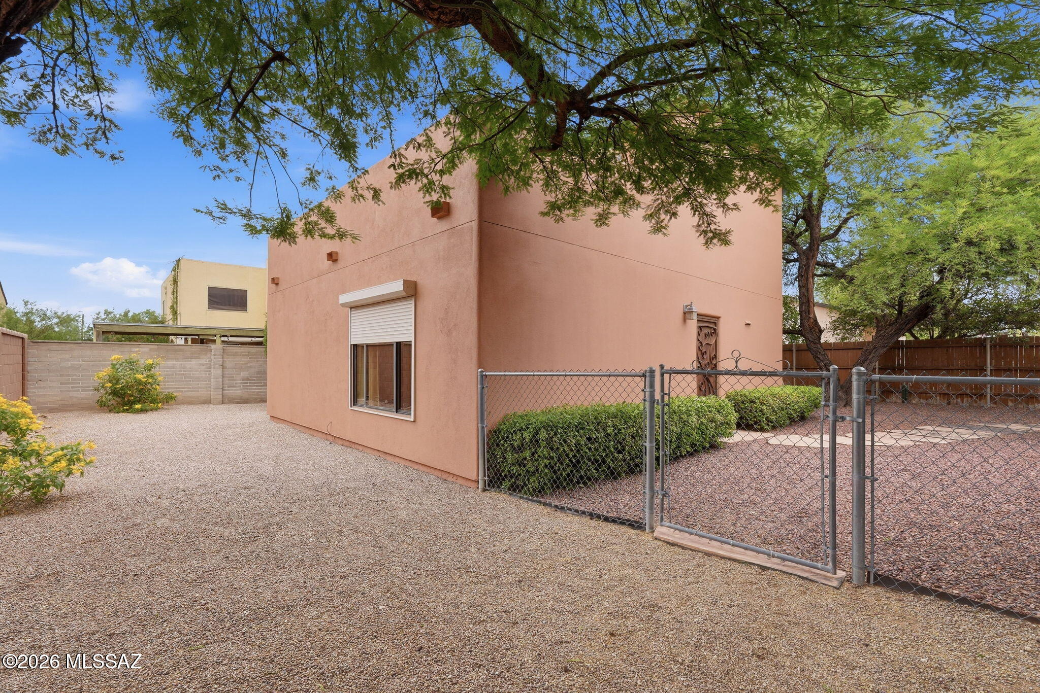 1125 East Kleindale Road Tucson, AZ 85719 - Photo 29 of 49 a view of a house with a tree in the background