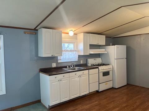 9 Miller Street Latrobe, PA 15650 - Photo 13 of 14 a kitchen with stainless steel appliances granite countertop a stove a sink and white cabinets
