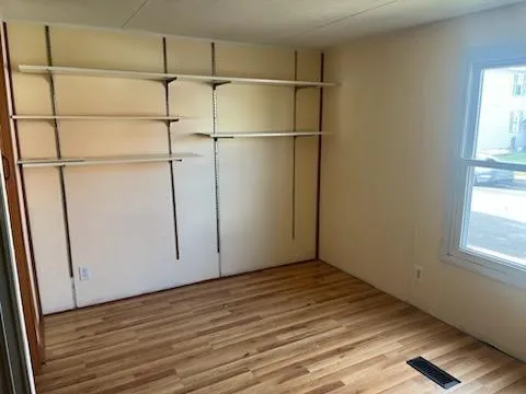 a view of an empty room with a window