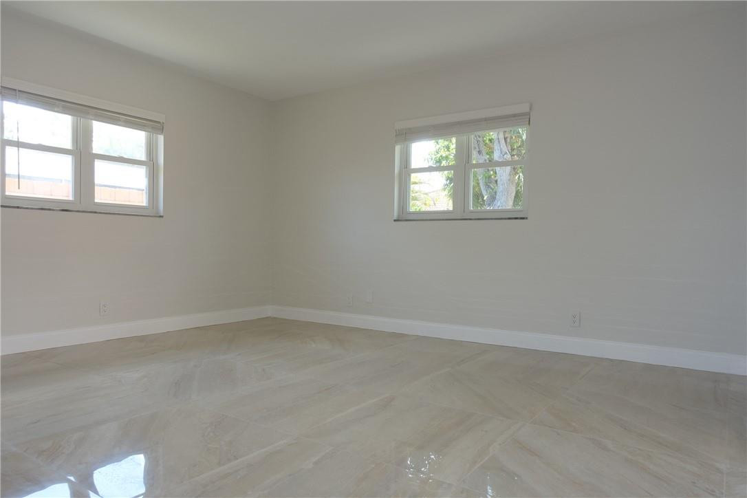 1311 Southwest 12th Avenue Boca Raton, FL 33486 - Photo 14 of 66 an empty room with windows