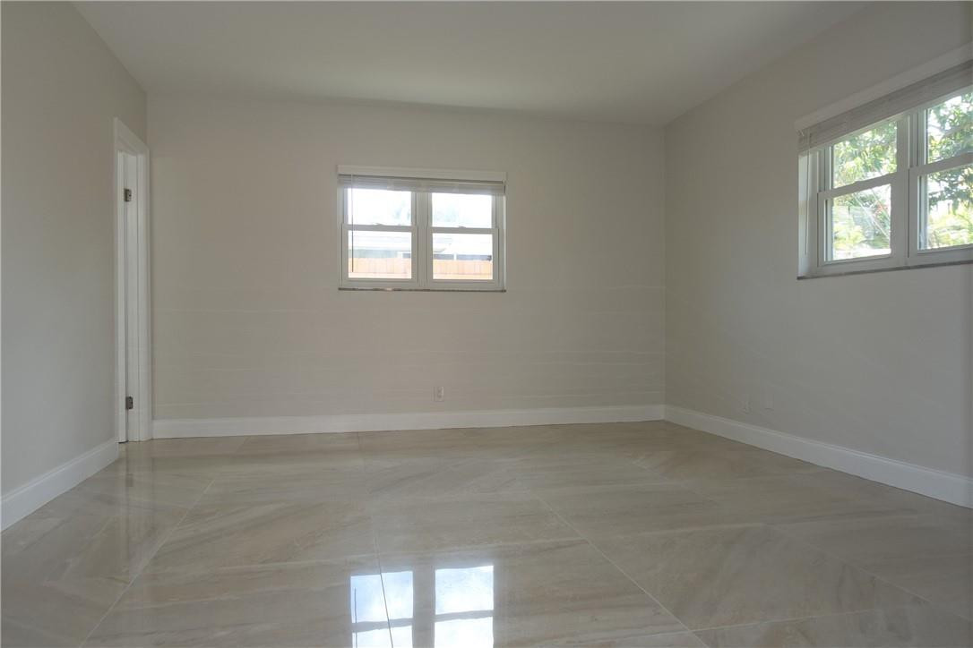 1311 Southwest 12th Avenue Boca Raton, FL 33486 - Photo 15 of 66 a view of an empty room with a window