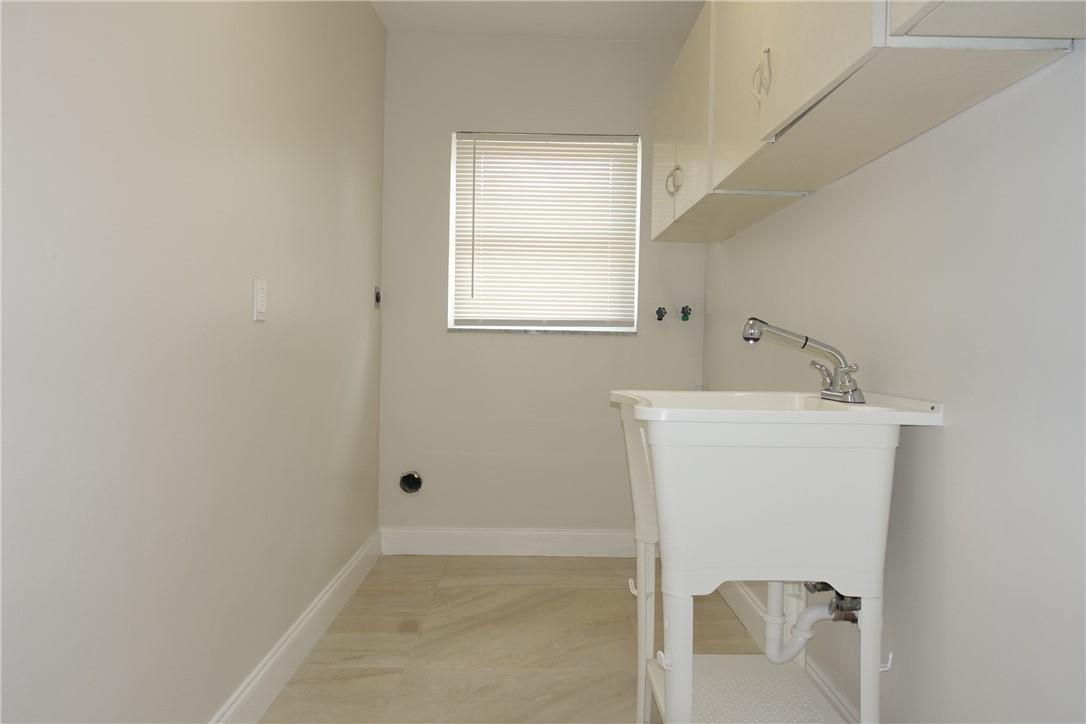 1311 Southwest 12th Avenue Boca Raton, FL 33486 - Photo 20 of 66 a bathroom with a bathtub sink and mirror